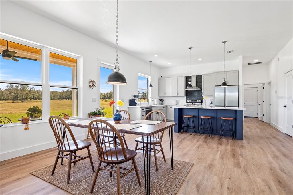 Dining room, Interior, Kitchen, Pendant Lights, Recessed Lighting, Stainless Steel Appliances, Wood Texture Flooring