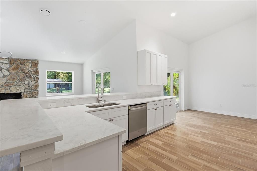 Fireplace, Interior, Kitchen, Recessed Lighting, Stone Walls, Wood Texture Flooring