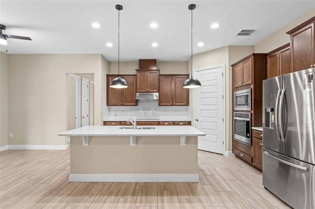 Interior, Kitchen, Pendant Lights, Recessed Lighting, Stainless Steel Appliances, Wood Texture Flooring