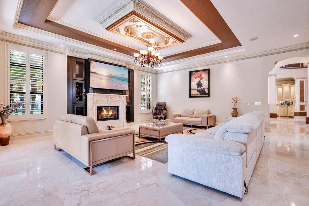 Chandelier, Fireplace, Interior, Living room, Marble, Recessed Lighting