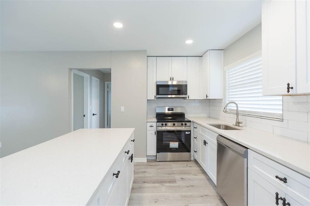 Interior, Kitchen, Recessed Lighting, Stainless Steel Appliances, Wood Texture Flooring