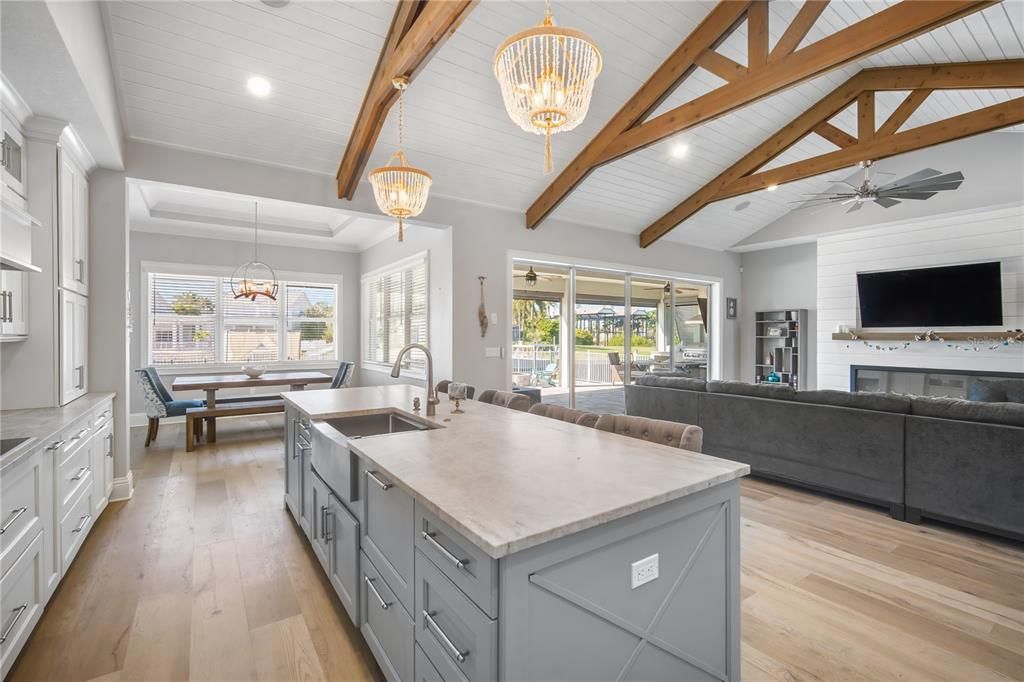 Chandelier, Dining room, Interior, Kitchen, Living room, Pendant Lights, Recessed Lighting, Wooden Beams, Wood Texture Flooring