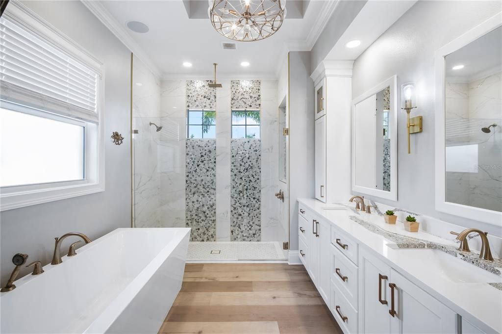 Bathroom, Chandelier, Dual Sink Vanities, Glass Shower, Interior, Marble Walls, Recessed Lighting, Wood Texture Flooring