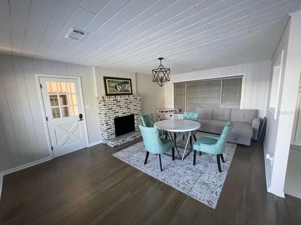 Dining room, Fireplace, Interior, Pendant Lights, Wood Texture Flooring