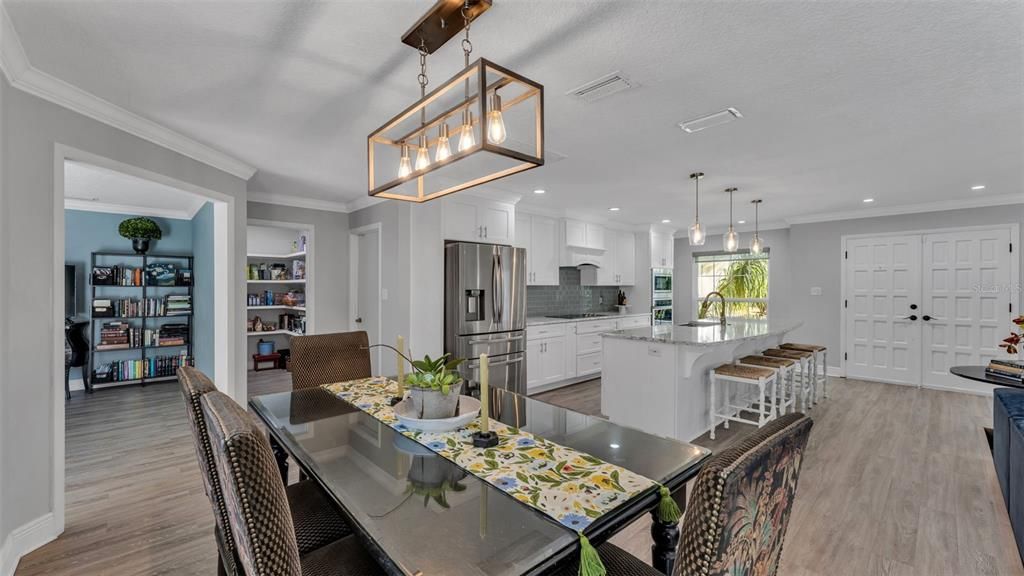 Dining room, Interior, Kitchen, Pendant Lights, Recessed Lighting, Stainless Steel Appliances, Wood Texture Flooring