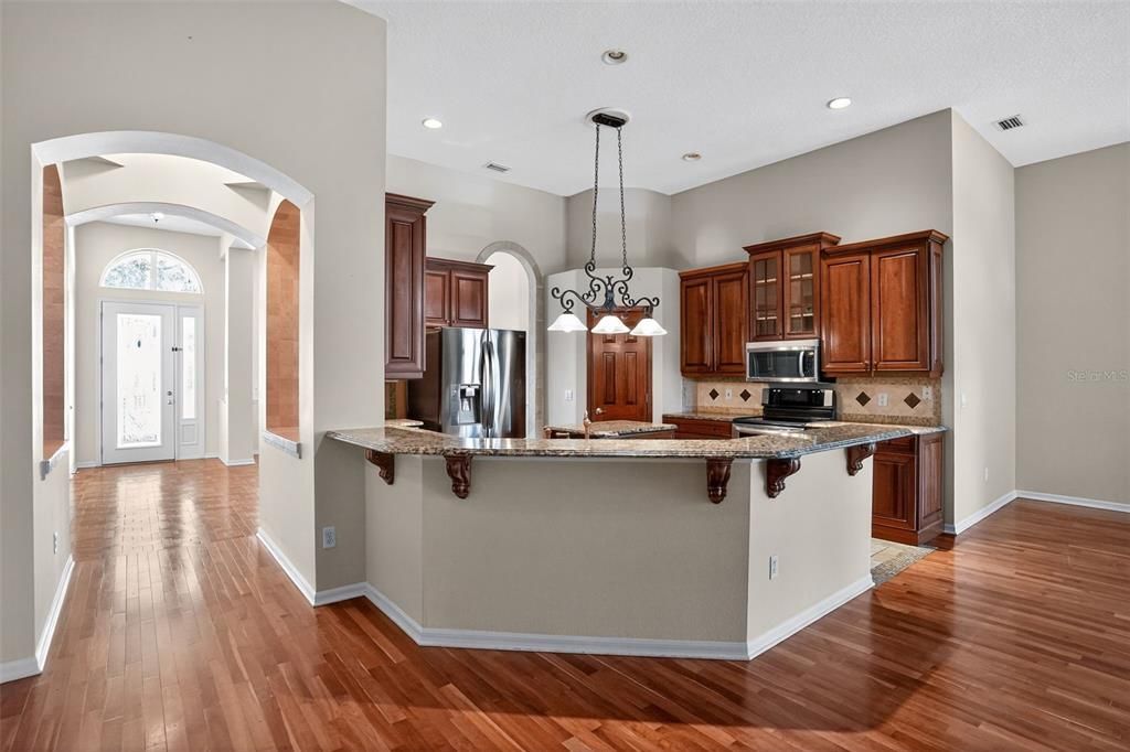 Chandelier, Interior, Kitchen, Pendant Lights, Recessed Lighting, Stainless Steel Appliances, Wood Texture Flooring