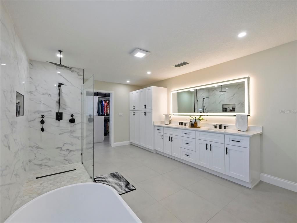 Bathroom, Dual Sink Vanities, Glass Shower, Interior, Marble Walls, Recessed Lighting