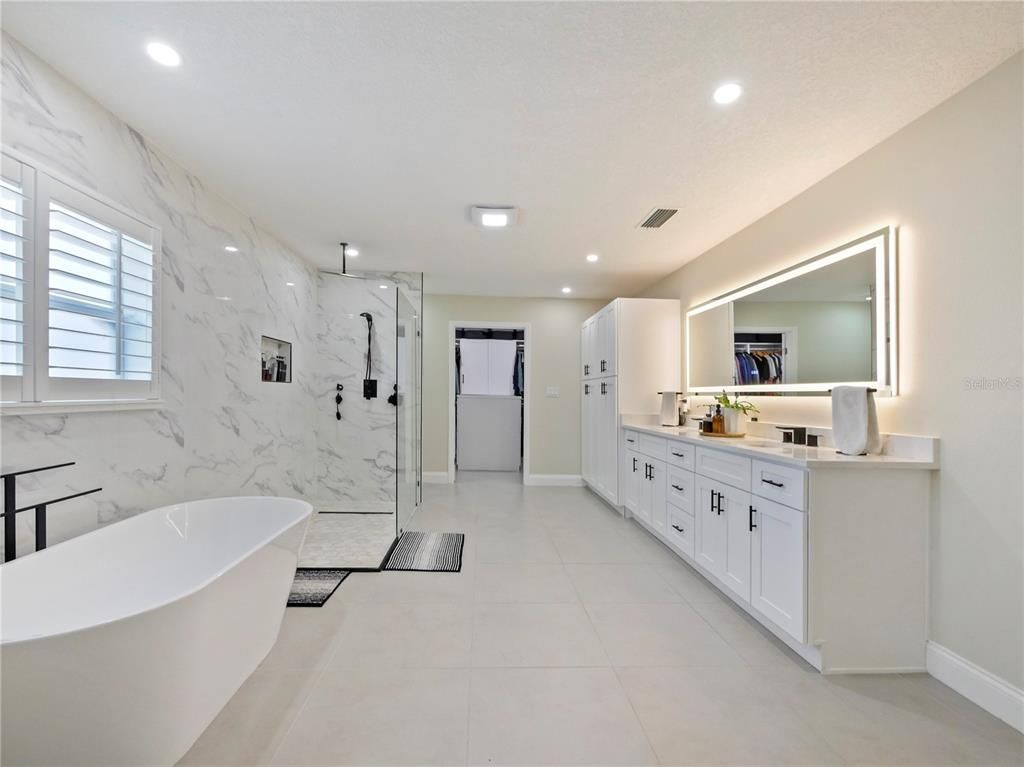 Bathroom, Dual Sink Vanities, Free Standing Baths, Glass Shower, Interior, Marble Walls, Recessed Lighting