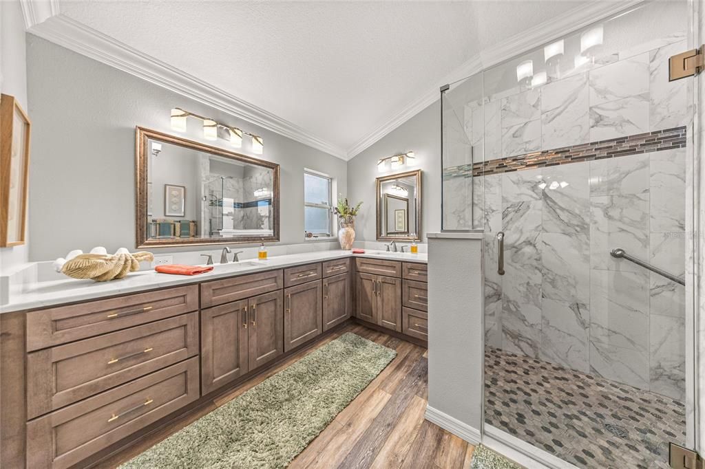 Bathroom, Dual Sink Vanities, Glass Shower, Interior, Marble Walls, Wood Texture Flooring