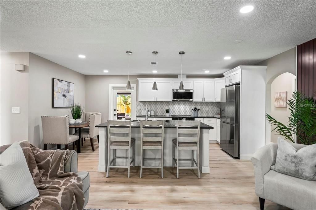 Dining room, Interior, Kitchen, Pendant Lights, Recessed Lighting, Stainless Steel Appliances, Wood Texture Flooring