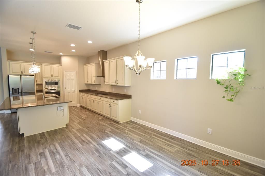 Chandelier, Interior, Kitchen, Pendant Lights, Recessed Lighting, Stainless Steel Appliances, Wood Texture Flooring