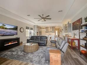 Chandelier, Fireplace, Interior, Living room, Pendant Lights, Recessed Lighting, Wood Texture Flooring