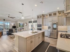 Dining room, Interior, Kitchen, Living room, Pendant Lights, Recessed Lighting, Stainless Steel Appliances, Wood Texture Flooring