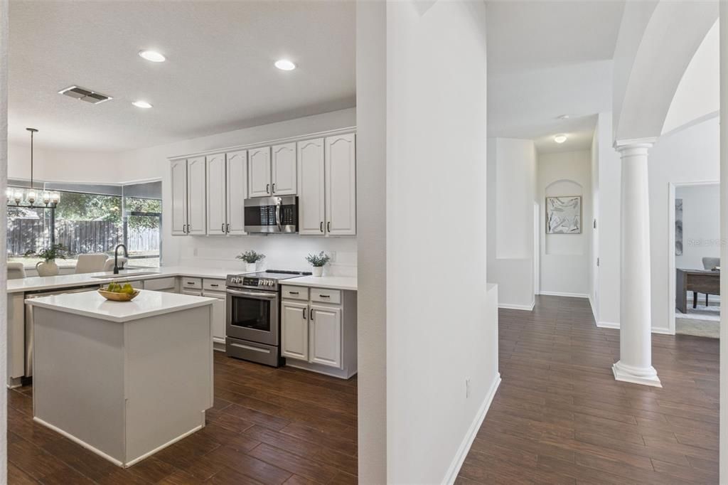Chandelier, Interior, Kitchen, Pendant Lights, Recessed Lighting, Stainless Steel Appliances, Wood Texture Flooring