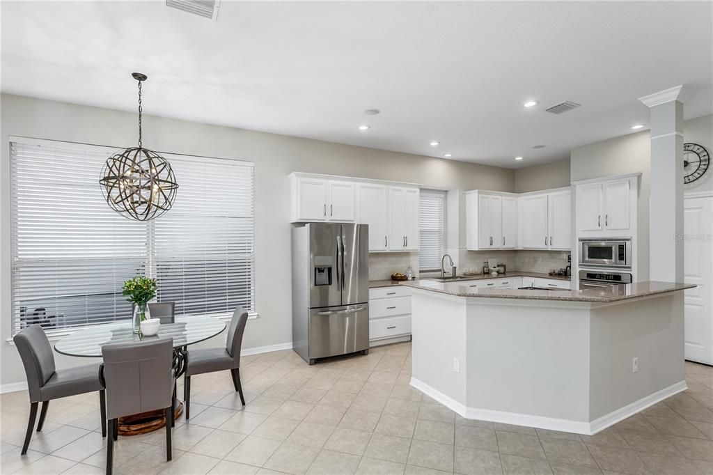 Chandelier, Dining room, Interior, Kitchen, Pendant Lights, Recessed Lighting, Stainless Steel Appliances