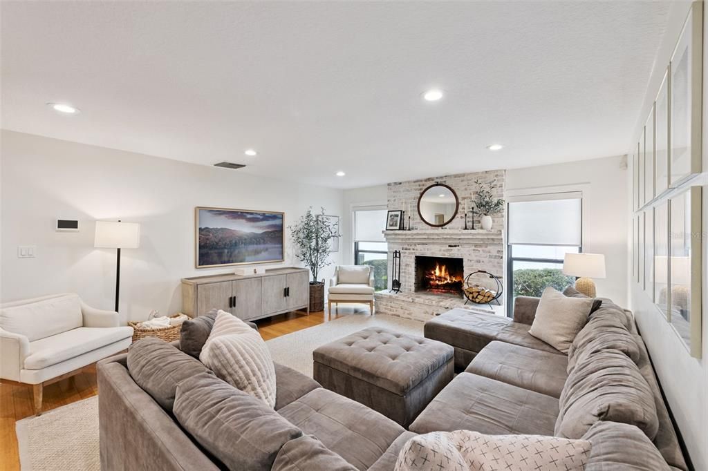 Fireplace, Interior, Living room, Recessed Lighting, Stone Walls, Wood Texture Flooring