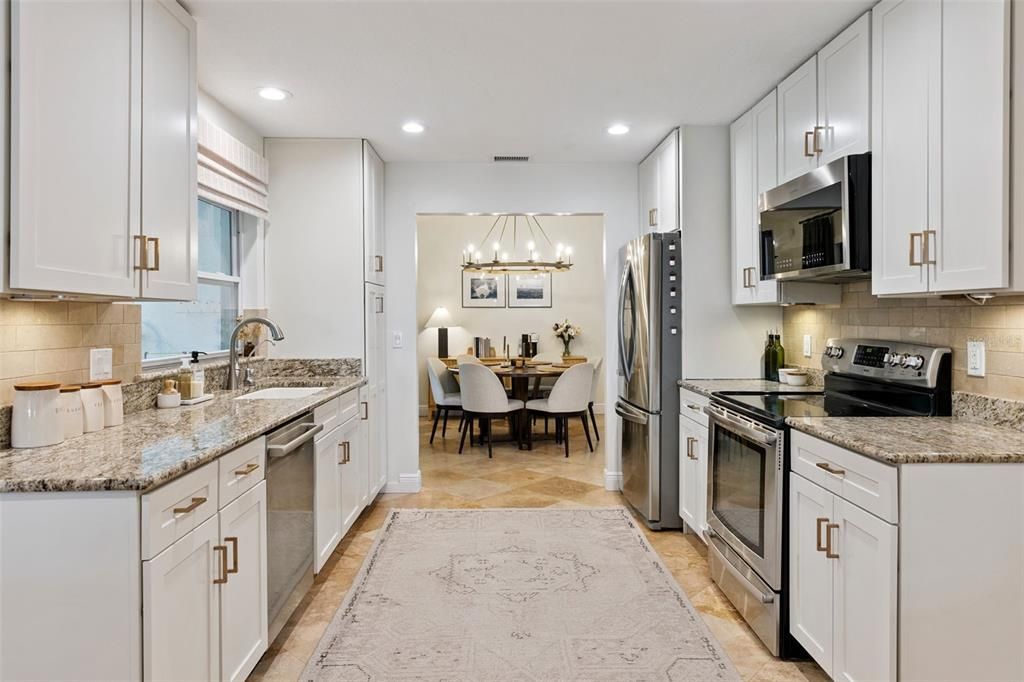 Chandelier, Dining room, Interior, Kitchen, Pendant Lights, Recessed Lighting, Stainless Steel Appliances