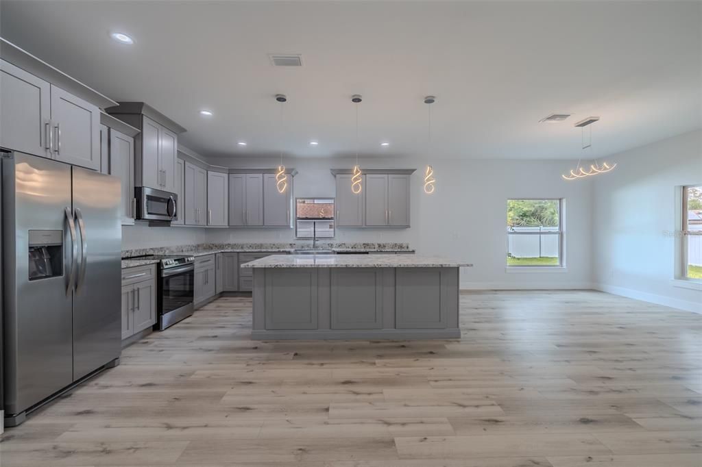 Interior, Kitchen, Pendant Lights, Recessed Lighting, Stainless Steel Appliances, Wood Texture Flooring