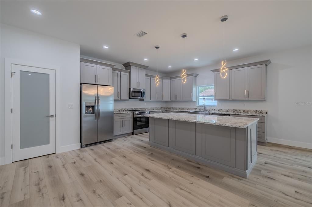 Interior, Kitchen, Pendant Lights, Recessed Lighting, Stainless Steel Appliances, Wood Texture Flooring