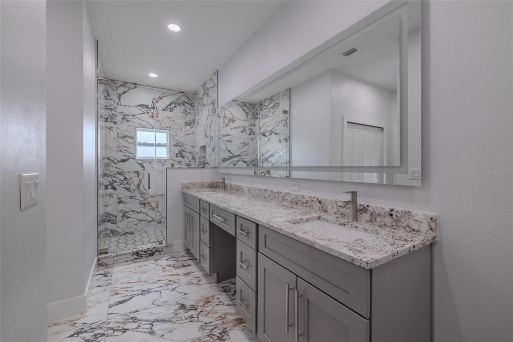 Bathroom, Dual Sink Vanities, Interior, Marble, Marble Walls, Recessed Lighting