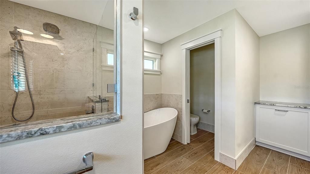 Bathroom, Free Standing Baths, Glass Shower, Interior, Recessed Lighting, Wood Texture Flooring
