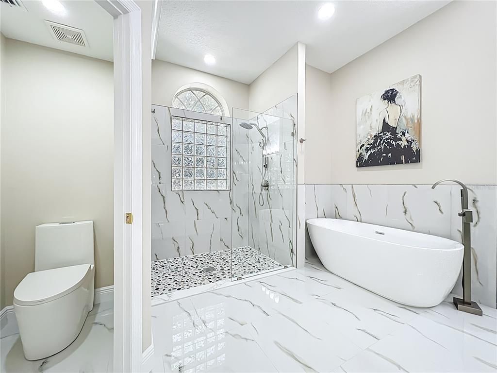 Bathroom, Free Standing Baths, Glass Shower, Interior, Marble, Marble Walls, Recessed Lighting