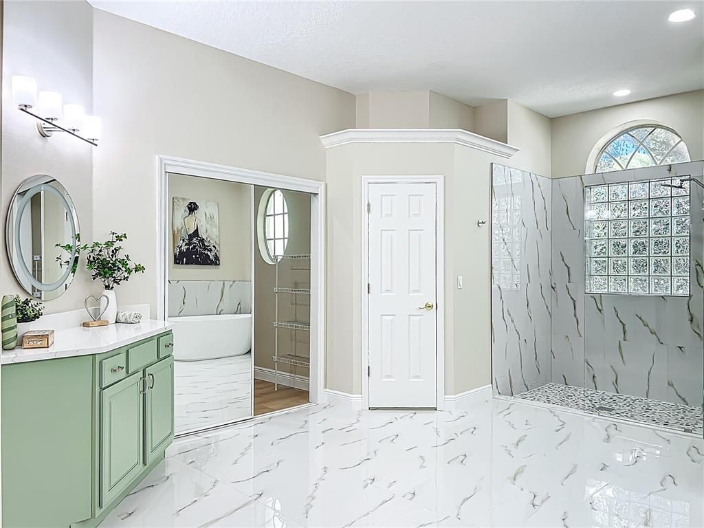 Bathroom, Dual Sink Vanities, Free Standing Baths, Interior, Marble, Marble Walls, Recessed Lighting