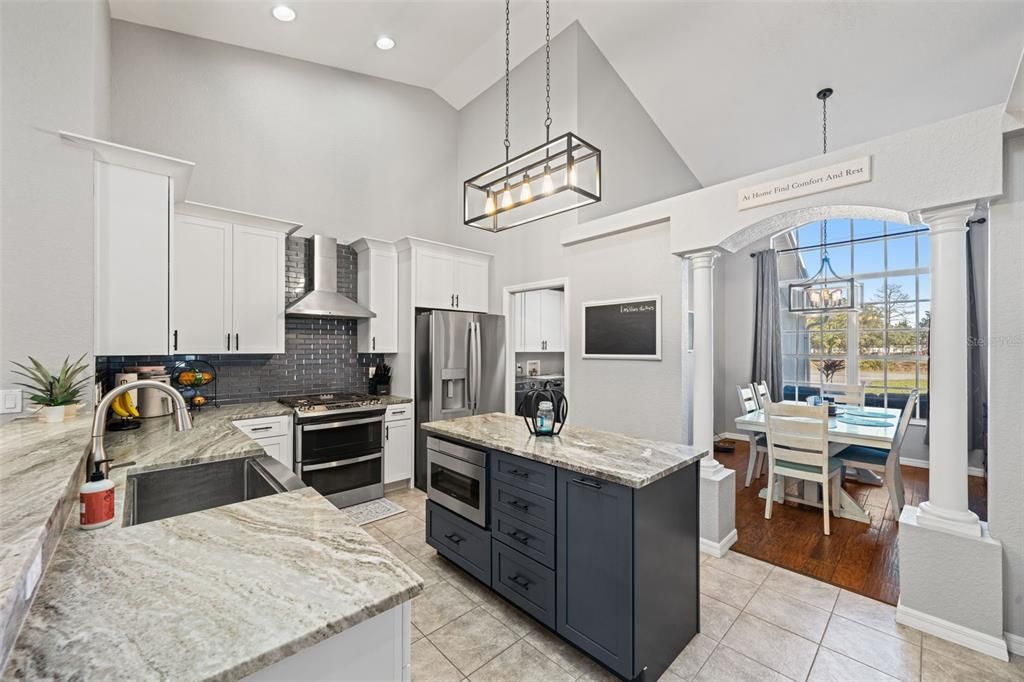 Chandelier, Dining room, Interior, Kitchen, Pendant Lights, Recessed Lighting, Stainless Steel Appliances, Wood Texture Flooring