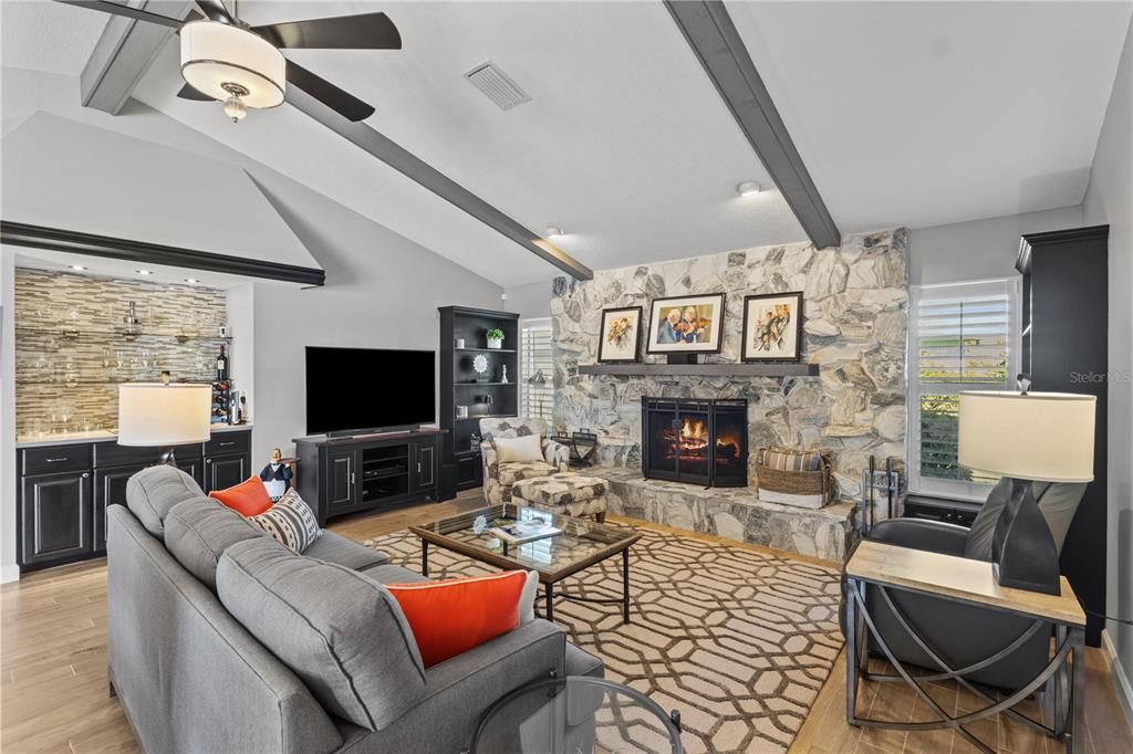 Fireplace, Interior, Living room, Recessed Lighting, Stone Walls, Wood Texture Flooring