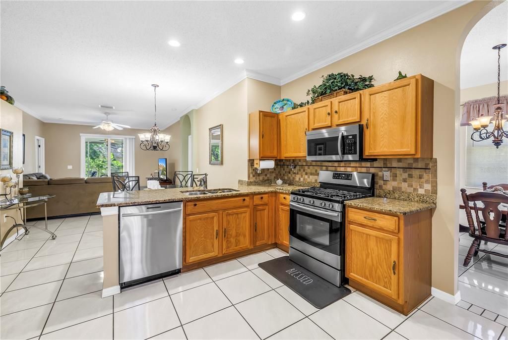 Chandelier, Dining room, Interior, Kitchen, Living room, Recessed Lighting, Stainless Steel Appliances
