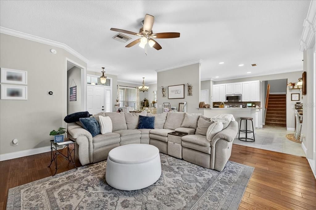 Chandelier, Dining room, Interior, Kitchen, Living room, Pendant Lights, Recessed Lighting, Stainless Steel Appliances, Wood Texture Flooring