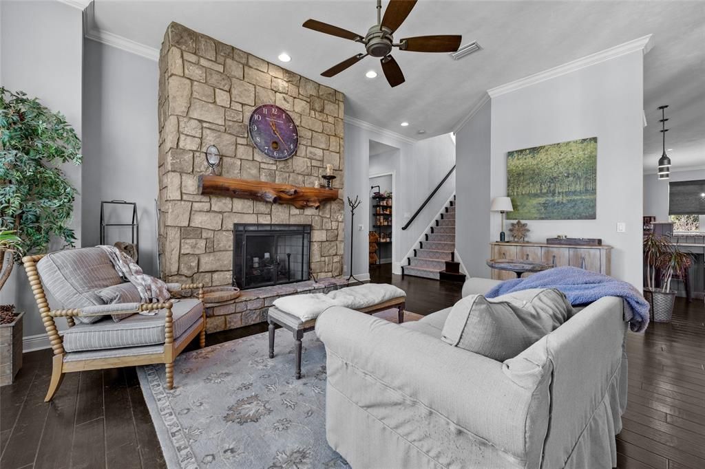 Fireplace, Interior, Living room, Recessed Lighting, Stone Walls, Wood Texture Flooring