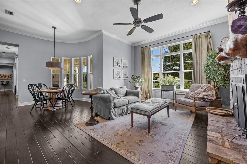 Dining room, Fireplace, Interior, Living room, Pendant Lights, Recessed Lighting, Wood Texture Flooring
