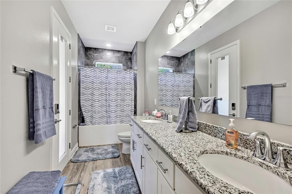 Bathroom, Dual Sink Vanities, Interior, Recessed Lighting, Wood Texture Flooring