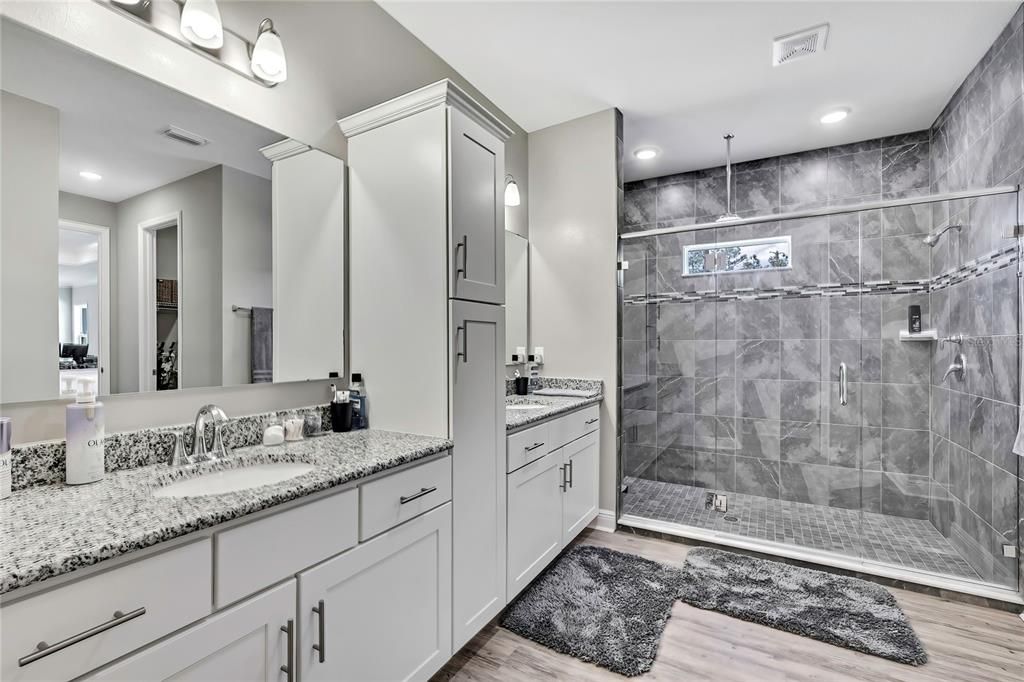 Bathroom, Dual Sink Vanities, Glass Shower, Interior, Recessed Lighting, Wood Texture Flooring