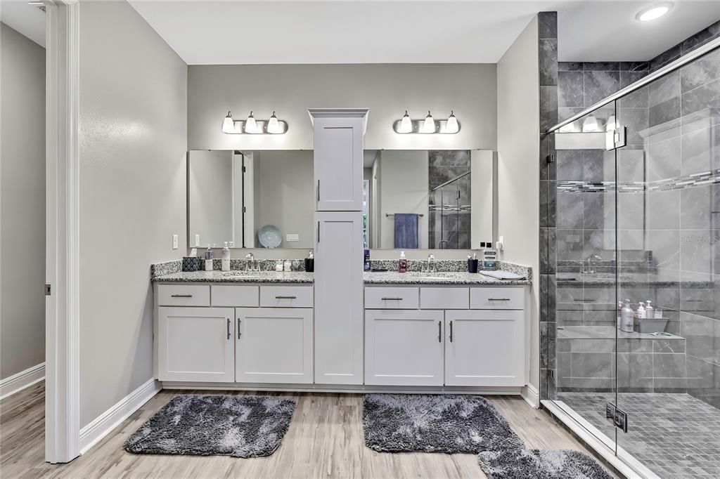 Bathroom, Dual Sink Vanities, Glass Shower, Interior, Recessed Lighting, Wood Texture Flooring