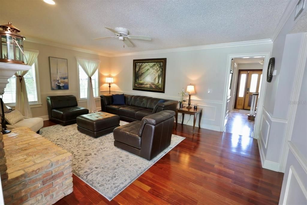 Fireplace, Interior, Living room, Recessed Lighting, Stone Walls, Wood Texture Flooring