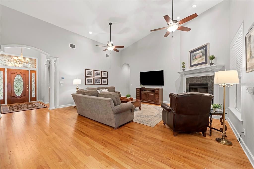 Chandelier, Fireplace, Interior, Living room, Recessed Lighting, Wood Texture Flooring