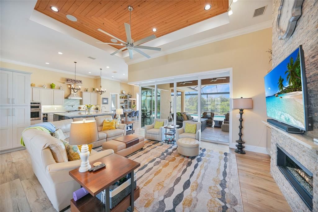 Dining room, Fireplace, Interior, Kitchen, Living room, Pendant Lights, Recessed Lighting, Stainless Steel Appliances, Wooden Ceilings, Wood Texture Flooring