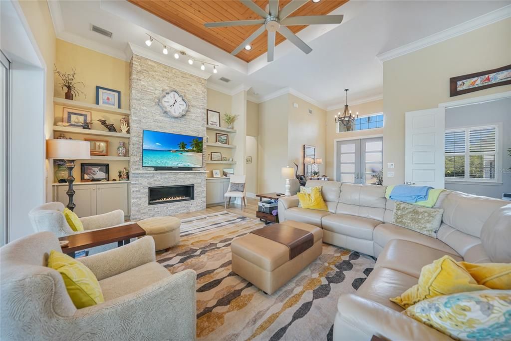 Chandelier, Fireplace, Interior, Living room, Pendant Lights, Recessed Lighting, Stone Walls