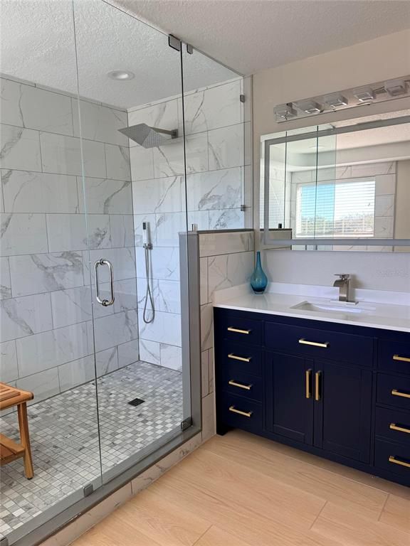 Bathroom, Glass Shower, Interior, Marble Walls, Recessed Lighting, Wood Texture Flooring