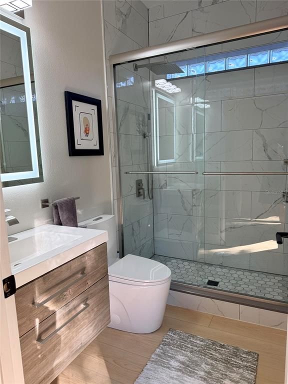 Bathroom, Glass Shower, Interior, Marble Walls, Wood Texture Flooring