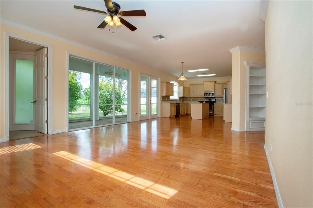 Empty room, Interior, Kitchen, Pendant Lights, Stainless Steel Appliances, Wood Texture Flooring
