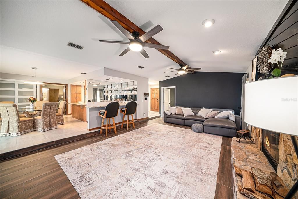 Dining room, Fireplace, Interior, Living room, Pendant Lights, Recessed Lighting, Wood Texture Flooring