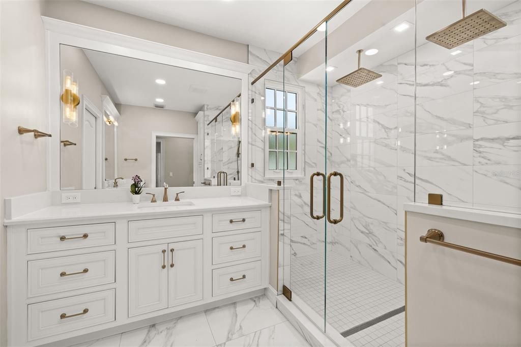 Bathroom, Dual Sink Vanities, Glass Shower, Interior, Marble, Marble Walls, Recessed Lighting