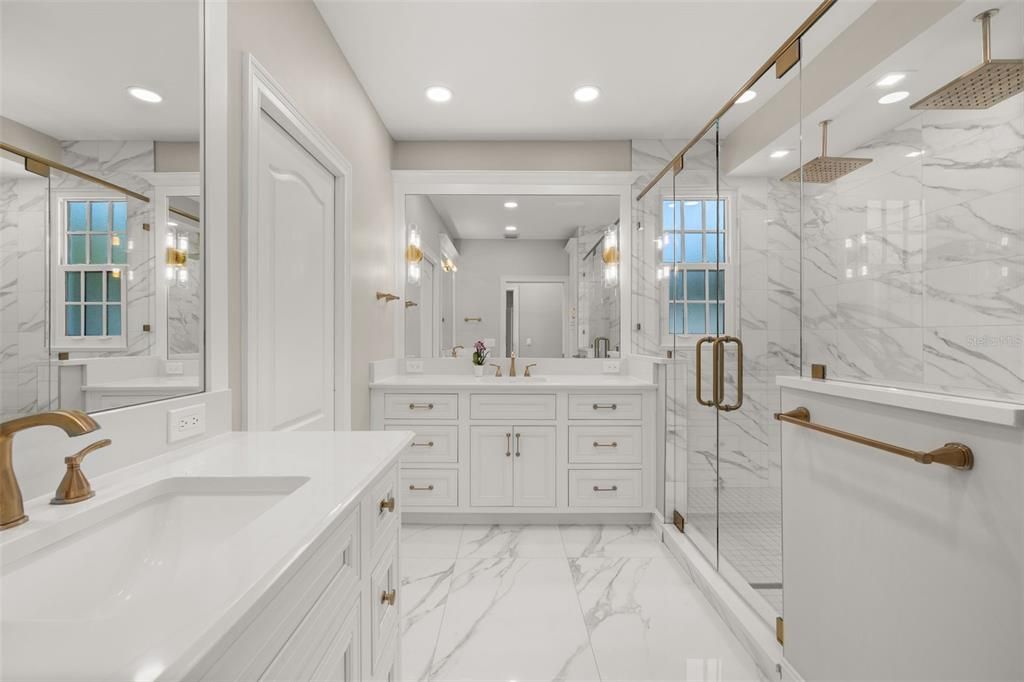 Bathroom, Dual Sink Vanities, Glass Shower, Interior, Marble, Marble Walls, Recessed Lighting