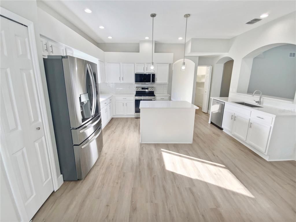 Interior, Kitchen, Pendant Lights, Recessed Lighting, Stainless Steel Appliances, Wood Texture Flooring