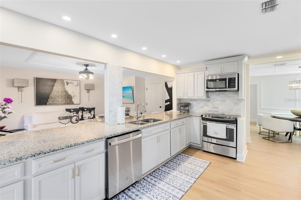 Dining room, Interior, Kitchen, Recessed Lighting, Stainless Steel Appliances, Wood Texture Flooring