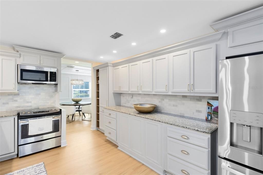 Dining room, Interior, Kitchen, Recessed Lighting, Stainless Steel Appliances, Wood Texture Flooring