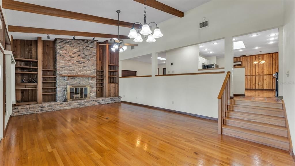 Empty room, Fireplace, Interior, Pendant Lights, Recessed Lighting, Stone Walls, Wooden Beams, Wood Texture Flooring
